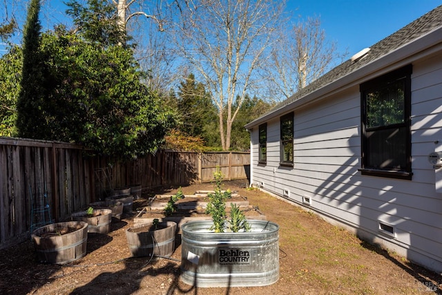 view of yard with a fenced backyard