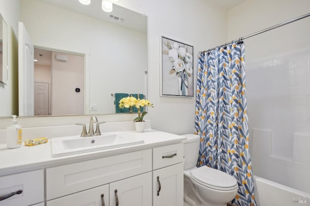 bathroom featuring visible vents, shower / bath combination with curtain, toilet, and vanity