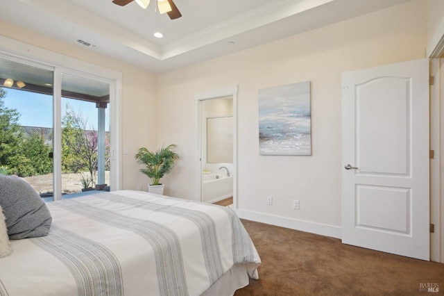 bedroom with access to exterior, visible vents, baseboards, dark carpet, and a tray ceiling