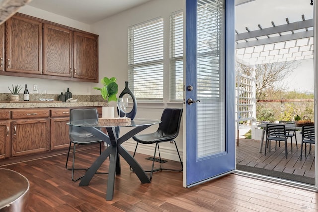 dining space featuring dark wood finished floors