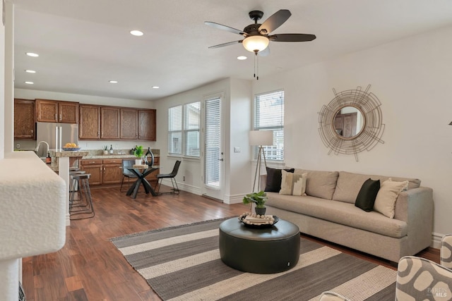 living room with recessed lighting, baseboards, dark wood-type flooring, and a ceiling fan