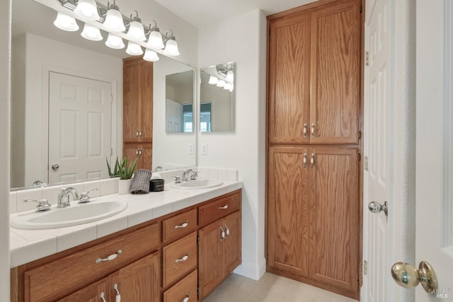 bathroom with a sink and double vanity