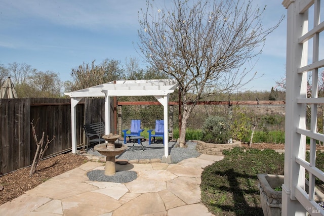 view of patio / terrace featuring a pergola and a fenced backyard