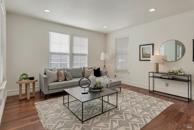 living room featuring recessed lighting, wood finished floors, and baseboards