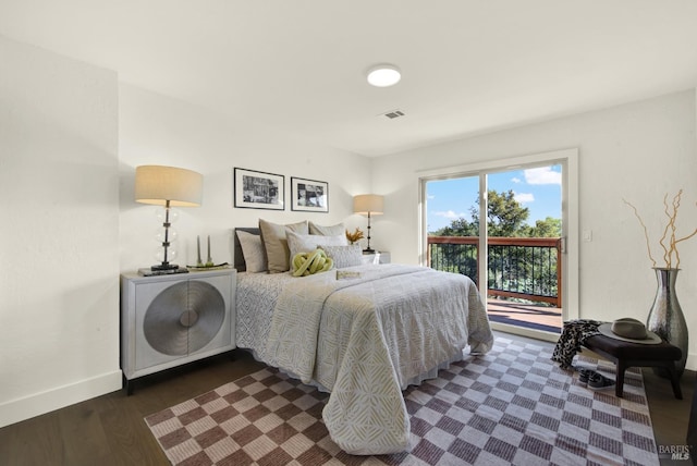 bedroom with access to outside, dark wood-style flooring, baseboards, and visible vents