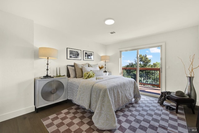 bedroom with visible vents, dark wood-style flooring, baseboards, and access to outside