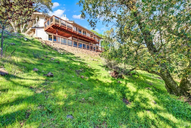 back of property with a wooden deck