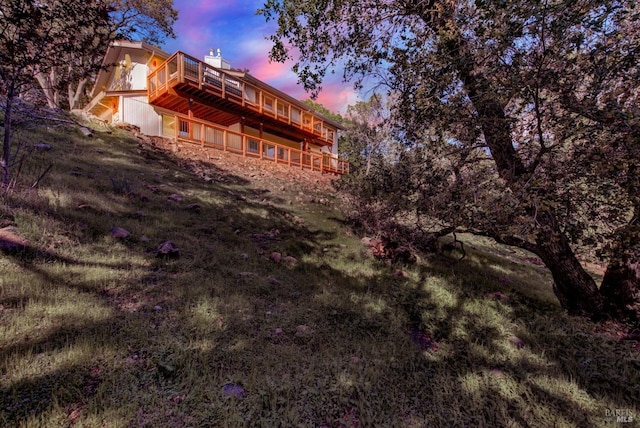 rear view of house featuring a deck