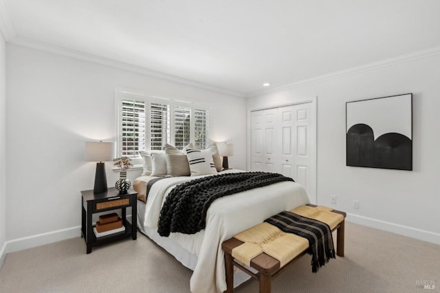 bedroom with baseboards, a closet, and ornamental molding