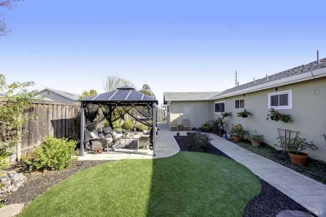 view of yard with a gazebo, a patio, and fence