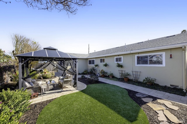 view of yard featuring a gazebo, a patio, and an outdoor hangout area