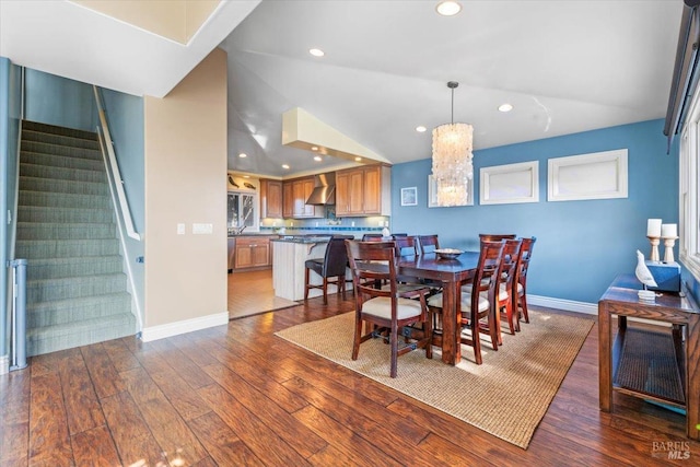 dining area with baseboards, stairs, vaulted ceiling, recessed lighting, and hardwood / wood-style flooring