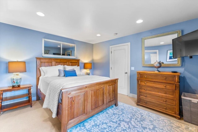 bedroom featuring recessed lighting, light colored carpet, and baseboards