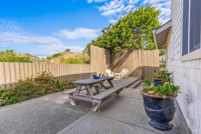 view of patio featuring a fenced backyard and outdoor dining space