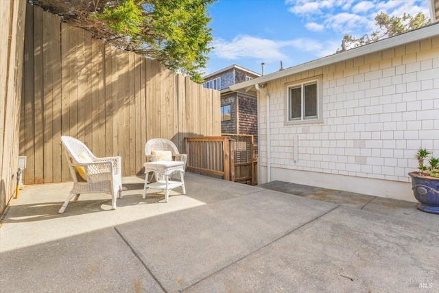 view of patio / terrace featuring fence