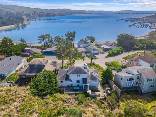 bird's eye view featuring a water view and a residential view