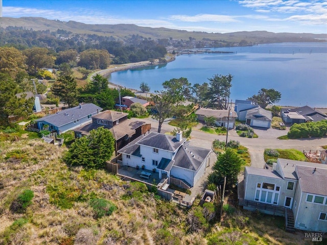 aerial view featuring a residential view and a water and mountain view