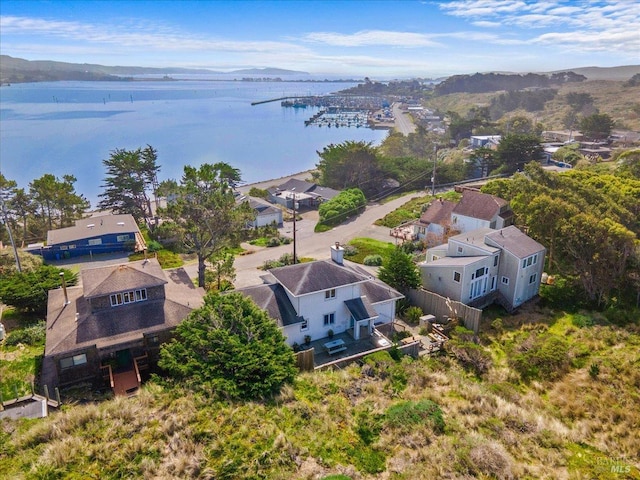 drone / aerial view with a residential view and a water view