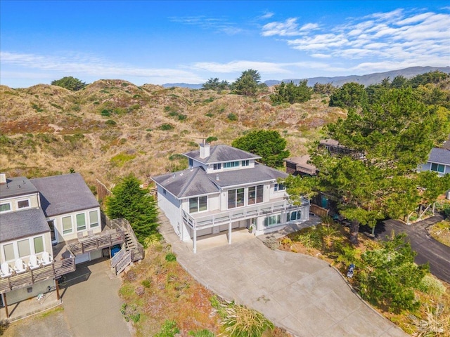 birds eye view of property featuring a mountain view