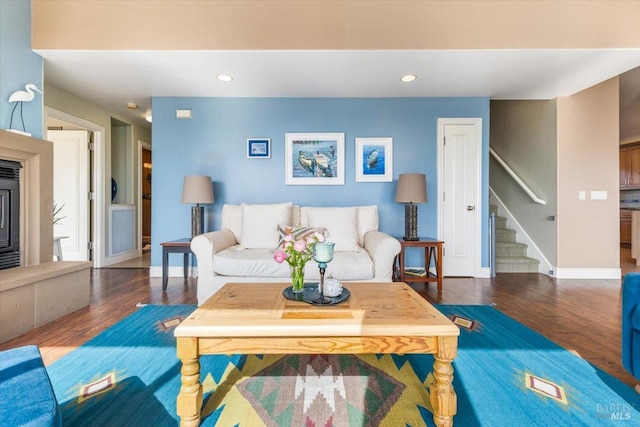 living room with stairway, recessed lighting, wood finished floors, and baseboards