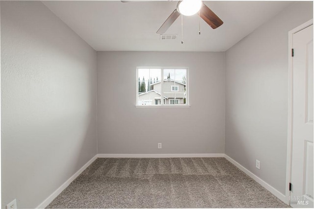 empty room featuring visible vents, baseboards, carpet, and ceiling fan