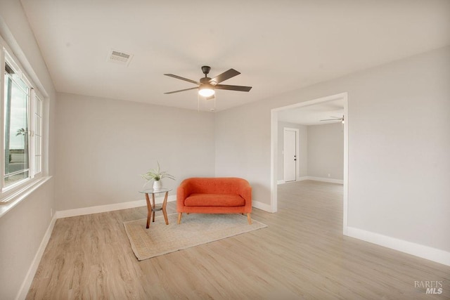 unfurnished room with visible vents, baseboards, a ceiling fan, and light wood finished floors