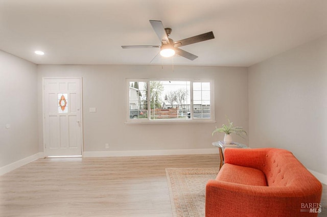 sitting room featuring recessed lighting, light wood-style flooring, baseboards, and ceiling fan