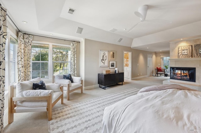 15 Kingswood Dr, Petaluma, CA 94952 - bedroom with light colored carpet, multiple windows, recessed lighting, a tray ceiling, and a multi sided fireplace