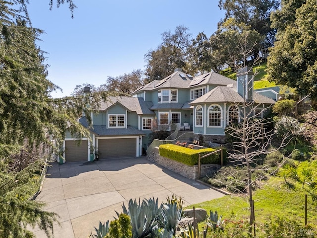 15 Kingswood Dr, Petaluma, CA 94952 - view of front of house featuring driveway and an attached garage