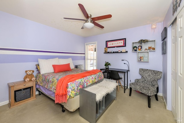 bedroom featuring a closet, carpet flooring, baseboards, and ceiling fan