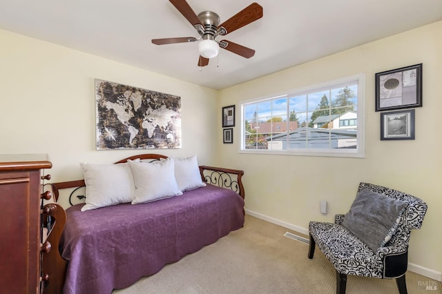 bedroom with carpet flooring, baseboards, visible vents, and a ceiling fan