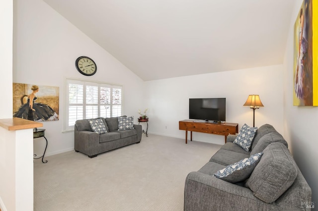 carpeted living area featuring high vaulted ceiling and baseboards