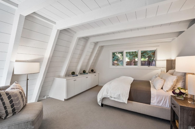 bedroom featuring beamed ceiling, light carpet, wooden walls, and wooden ceiling