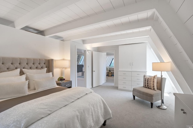 bedroom with light carpet and beamed ceiling