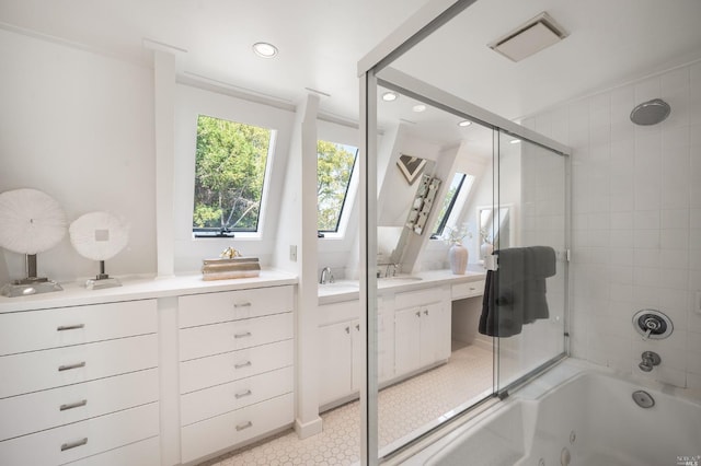 bathroom with vanity, recessed lighting, visible vents, and a combined bath / shower with jetted tub