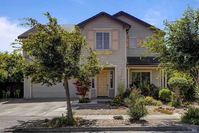 view of front of house featuring concrete driveway and an attached garage