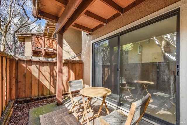 deck featuring outdoor dining space and fence