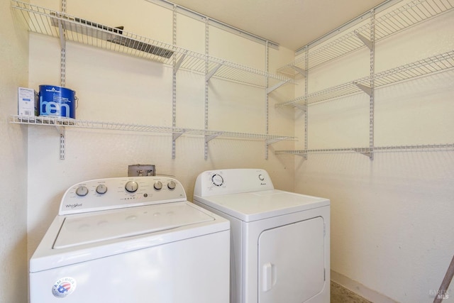 clothes washing area featuring laundry area and independent washer and dryer