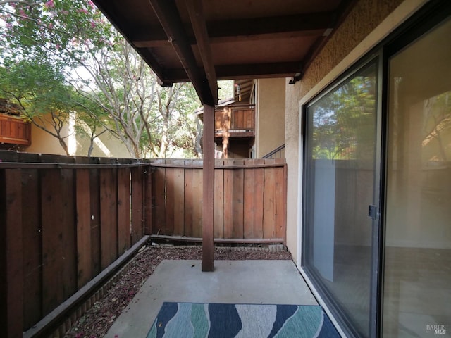 view of patio / terrace featuring fence