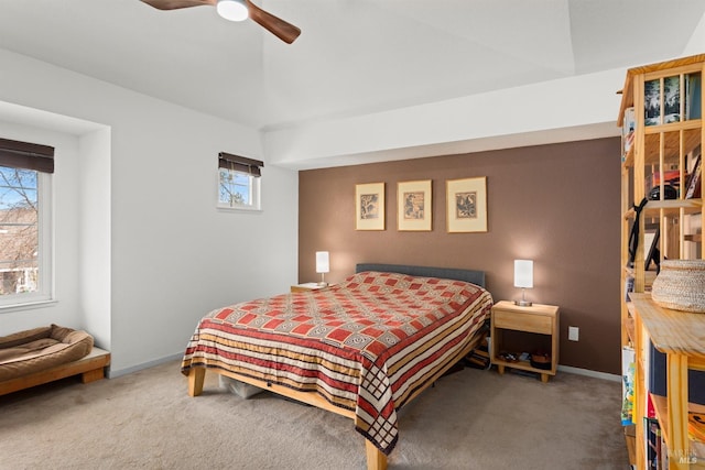 bedroom featuring baseboards, a ceiling fan, and carpet flooring