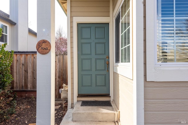 property entrance featuring fence