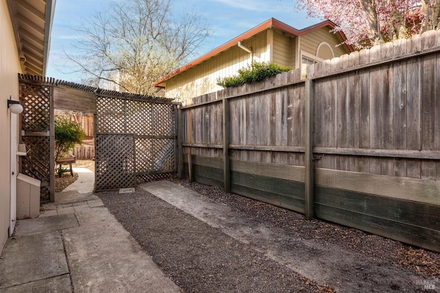 view of patio featuring a fenced backyard and a pergola