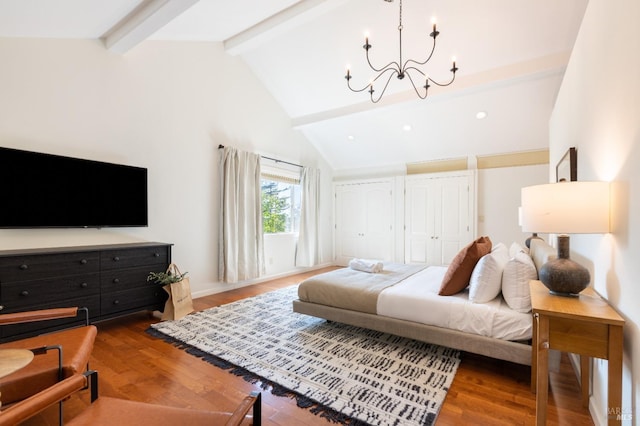 living room featuring a chandelier, beamed ceiling, high vaulted ceiling, and wood finished floors