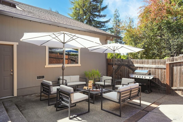 view of patio with an outdoor living space, area for grilling, and fence