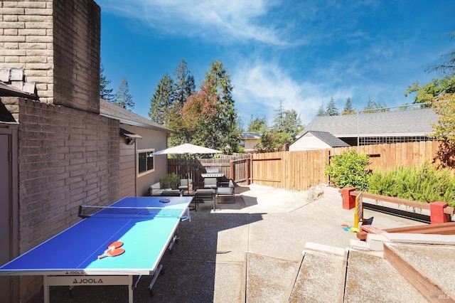 view of patio / terrace featuring fence