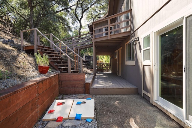 view of patio / terrace featuring stairway and a wooden deck