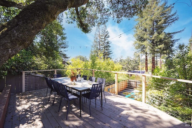 deck featuring outdoor dining area