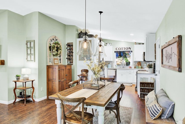 dining area with dark wood finished floors, recessed lighting, and baseboards