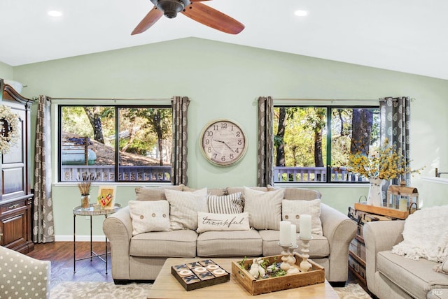 living area featuring wood finished floors, baseboards, lofted ceiling, recessed lighting, and ceiling fan