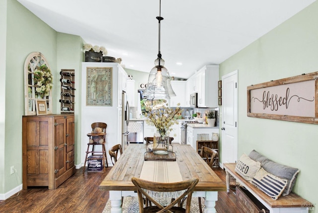 dining space with baseboards and dark wood-style floors